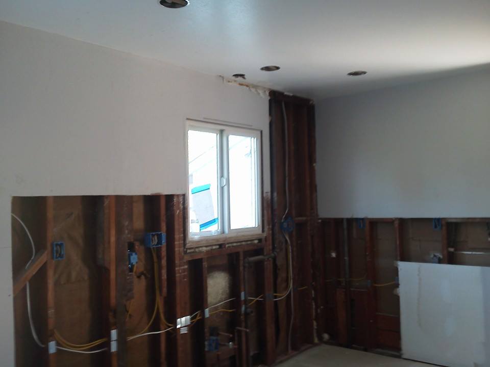 Open wall showing wiring in progress